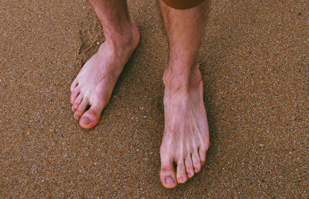 walking on the beach barefoot